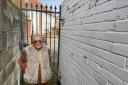 Victoria Barton outside the secure gate in Porterstfield Road, Norwich