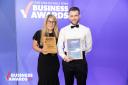 Caribbean Blinds managing director Stuart Dantzic and estimator Rachel Cutmore picking up the Medium Business of the Year award