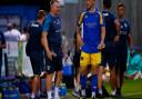 King's Lynn Town defender Josh Coulson chats to Norwich City head coach Dean Smith after the friendly match at The Walks