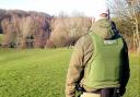 An Environment Agency enforcement officer on patrol near a river.