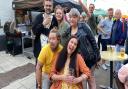 Friends enjoy the atmosphere at the Jubilee street party on King Street in Norwich, hosted by the Last Pub Standing.