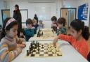 Photo 002 - Young chess players competing, left to right: Namira Ahmed (NJCC), Ruthven Ridley (Broadland), Kacper Golan (NJCC), Rafe Ridley (Broadland), Yaseen Mohammed (NJCC) & Sharvari Saharkar (NJCC).