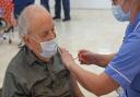 A man having his COVID-19 vaccination at the Castle Quarter Vaccination Centre in Norwich.