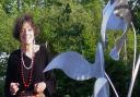 The sculptor Ros Newman has died aged 82. Here she is photographed with her famous sculpture, the Flight of Birds, which is on display at the Norfolk and Norwich University Hospital