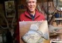 Roger Brookes, fish carver extraordinaire, with his John Dory