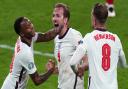 Raheem Sterling, Harry Kane and Jordan Henderson celebrate victory over Denmark at Wembley