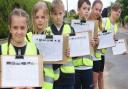 Horsford Primary School children doing a traffic survey,  who have started an online petition for a safe cycleway as it is too dangerous for them to cycle to school due to the heavy traffic on Holt Road in the village. From left, Talia, 11; Maizie, 10;