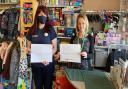 Lorraine Curston (right), founder of Sprowston-based Dawn's New Horizon, in its charity shop on Cannerby Lane, with Christina Martin, a community champion for the domestic abuse support group from Harford Bridge Tesco store.