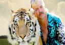 Tiger King Joe Exotic with one of the animals from his zoo