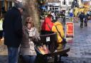 People out enjoying a bite to eat at Norwich Market.