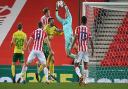 Michael McGovern grabs a cross during the game against Stoke City in midweek