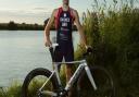 Steven Barnes proudly displays his GB race suit.