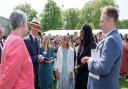 Hannah Furborough, centre, and Folusho Bello with The Duke of Edinburgh