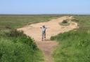 Skip gets excited on Stiffkey Marshes at the thought of Viking ships beaching on a distant strand