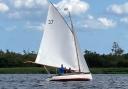 A river cruiser sailing on Barton Broad