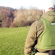 An Environment Agency enforcement officer on patrol near a river.