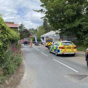 Emergency services at the scene at Tyre Pros Acle after a motorcyclist crashed into it.