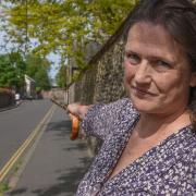 Sarah Walker pointing to where she thinks she may have seen the ghost carriage driven by Sir Thomas near Bishop's Bridge in Norwich. Picture: Danielle Booden