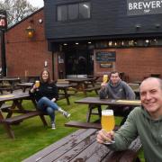 Owner Mark White, front, with from left, Charlotte Cole, Charley Austin, and Dan Arden, test the beer ready for the reopening of the Brewery Tap on Monday when lockdown restrictions are relaxed.