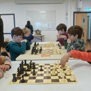 Photo 002 - Young chess players competing, left to right: Namira Ahmed (NJCC), Ruthven Ridley (Broadland), Kacper Golan (NJCC), Rafe Ridley (Broadland), Yaseen Mohammed (NJCC) & Sharvari Saharkar (NJCC).