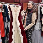 Debra Brown with a cloak worn to the Queen's coronation which is part of a vintage fashion sale at TW Gaze