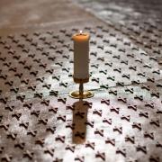 Crosses on the floor in Norwich Cathedral in 2021 representing victims of Covid