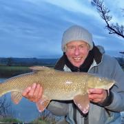 John Bailey, scruffy as a scarecrow, happy with his winter barbel