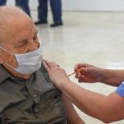 A man having his COVID-19 vaccination at the Castle Quarter Vaccination Centre in Norwich.