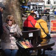 People out enjoying a bite to eat at Norwich Market.