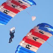 The RAF Falcons Parachute Display Team free fall into the Grand Ring. Picture: Ian Burt