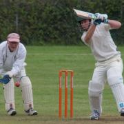 North Elmham'’s James Dagless patiently grafting for his runs in the gathering gloom. Picture: MIKE WYATT