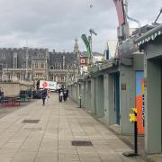 The majority of Norwich Market's outward-facing traders have shut up shop as Storm Eunice hits the city