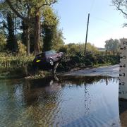 The Audi A3 crashed into the bank at Shotesham Ford