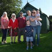 Arminghall Village Hall has been saved. L-R: Lynette Price, Mary and Les Dawson, Sandra Browne and Sophie Harvey with Blake and Isla