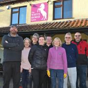 Staff and volunteers outside the White Horse pub in Upton ahead of its relaunch on January 13. Image: Sonya Duncan