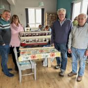 Brother and sister Brian Rogerson and Barbara Hendon (left) have been reunited with their father's restored model tram. Also pictured: Ian McDonald and Pat Callow (far right)