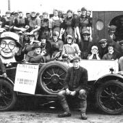 Empire manager Edward Bowles visits Scots fisher lasses and Fishwharf workers to hand out glasses and promote the Harold Lloyd film in the 1920s