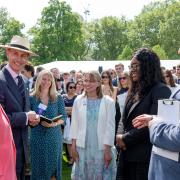 Hannah Furborough, centre, and Folusho Bello with The Duke of Edinburgh