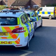 Police were spotted following reports a body was found in a woods near Norwich