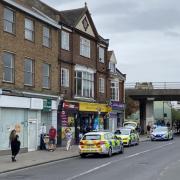 A man has been arrested outside the Premier store in Magdalen Street