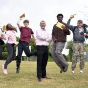 Hewett Academy head, Antony Little, with some of the students celebrating their GCSE results.