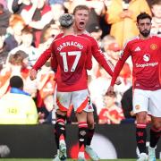 Rasmus Hojlund (centre) celebrates with Alejandro Garnacho after scoring their side’s second goal of the game during the Premier League match at Old Trafford, Manchester. Picture date: Saturday October 19, 2024.