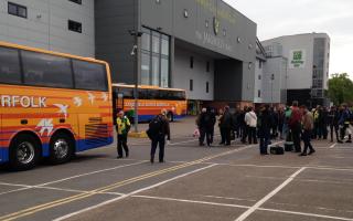 Fans loading on to Sanders Coaches for an away game