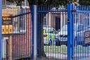 Police car outside City of Norwich School yesterday.