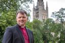 The Bishop of Norwich the Rt Rev Graham Usher in his garden