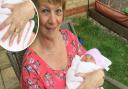 Sandra Ireson holding her newborn granddaughter Josie. Pictured: The missing wedding ring.