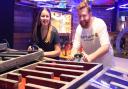 Louisa Baldwin and James Randle play crazier golf at the newly opened Boom: Battle Bar in Norwich's Castle Quarter. Picture: DENISE BRADLEY