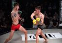 Chey Veal, right, tries to land a right hand on Duncan Djillali in their bantamweight title clash at Road to Contenders. Picture: BRETT KING