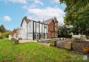 An eight-bedroom house with a corner turret and outdoor pool is for sale in Eaton