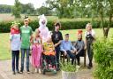 Care home residents took on a charity walk in fancy dress in aid of Macmillan Cancer Support